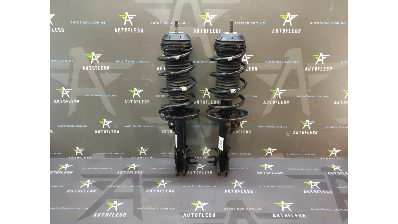 Б/в амортизатор передній у зборі 13214357, 13214358 для Opel Corsa D
