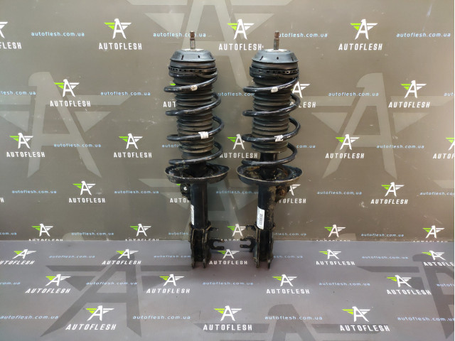Б/в амортизатор передній у зборі 13214357, 13214358 для Opel Corsa D